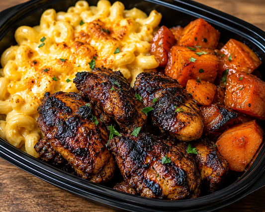 Grilled jerk bonless chicken thighs  with creamy Mac and cheese and candied yams